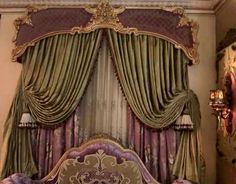 an ornate bed with purple and gold decor