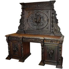 an old wooden desk with carvings on the top and bottom part, sitting in front of a white background