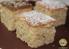 two pieces of cake sitting on top of a brown plate