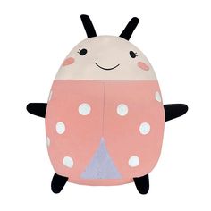 a pink and white ladybug shaped pillow with polka dots on it's chest