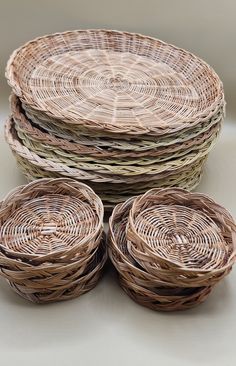 four wicker baskets stacked on top of each other