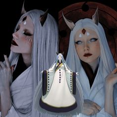 two women dressed in white with horns and makeup