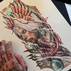 a person with tattoos on their hands is drawing