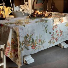 a table covered with a floral print cloth