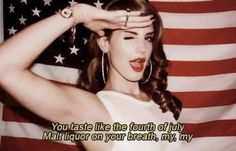 a woman in front of an american flag with the words you taste like the fourth of july mail up on your breath, my heart