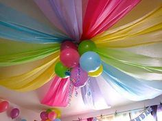 the ceiling is decorated with balloons and streamers