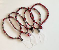 "These dark, bold colors go together so well. I was aiming for a Vampire theme wristband and I think they're just perfect! These are read-made items that will ship by the next business day. Red and black faceted beads. Approx 6\" long. Attach one to your cell phone, tablet, keychain, Tamagotchi or anything else that has a charm attachment on it. *THE BANDS GO IN ORDER OF INDIVIDUAL PHOTOS IN THE DROPDOWN FROM 1 TO 5. IF YOU HAVE ANY QUESTIONS ABOUT THIS PLEASE MESSAGE ME FIRST AS THESE ARE ONE O Keychain Lanyard, Red Sparkle, Pretty Packaging, Electronic Toys, Phone Charm, Figure It Out, Faceted Bead, Sd Card, Black Beads