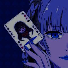 a woman holding up a playing card in front of her face