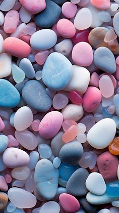 many different colored rocks and pebbles together