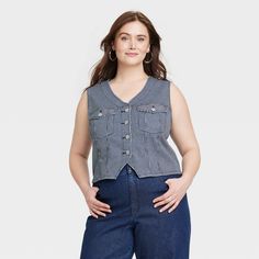 This Button-Front Denim Vest from Universal Thread™ will make a cool addition to your denim collection. Made from midweight cotton fabric with added stretch in a regular fit, it offers comfortable all-day wear. The flattering V-neckline, button-front design and chest flap pockets add touches of classic style. You can wear this sleeveless denim vest with high-waist pants, skirts and more for a variety of chic ensembles. Universal Thread™: Found exclusively at Target. Womens Denim Vest, Pants Skirts, Denim Collection, Universal Thread, Waist Pants, Front Design, Denim Vest, A New Day, High Waisted Pants