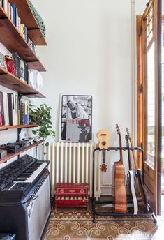 a living room filled with furniture and musical instruments
