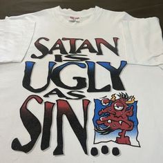 Satan Is As Ugly As Sin T-Shirt Fast Shipping $25 Lowest I Can Do Custom Deadstock Hit Me With Questions Vintage Tee Design Graphics, Grailed Clothing, Jesus Tees, Vintage Graphic Tee, Tshirt Design Inspiration, Street Fashion Men Streetwear, Fashion Shirts, Shirt Design Inspiration, Fashion White