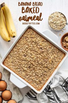 banana bread baked oatmeal in a white baking dish next to eggs and bananas