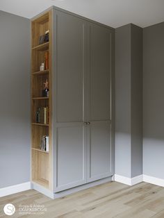 an empty room with a bookcase and bookshelf in the corner, next to a wooden floor