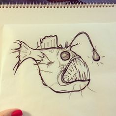 a drawing of a fish with its mouth open