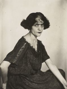 an old black and white photo of a woman