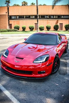 a red sports car parked in a parking lot