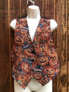 "Halloween size small tapestry vest with Jacko lantern print. Measurements taken across front laid flat 17.5\" across front armpit to armpit 18\" across waist 22\" length" Lanterns, Tapestry, Halloween Tapestry, Tapestry Vest, Small Tapestry, Black And Orange, Vest Outfits, Dec 30, Womens Vest