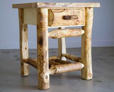 a small wooden table with two drawers