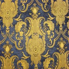 an old blue and gold wallpaper with ornate designs