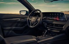 the interior of a car with dashboard and steering wheel