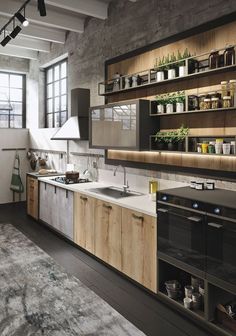 an industrial style kitchen with wooden cabinets and open shelvings on the wall above the sink