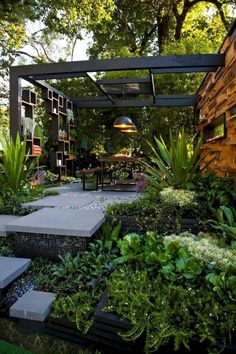 an outdoor area with plants and steps leading to the outside patio, surrounded by greenery