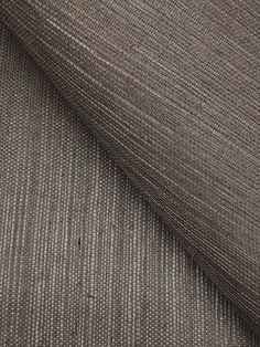 a close up shot of the fabric in grey and white stripes on a piece of cloth