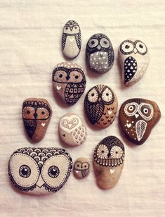 the rocks have different designs on them and are painted to look like owl's