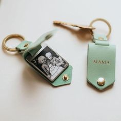 a keychain with a photo on it and a couple's name tag attached to it