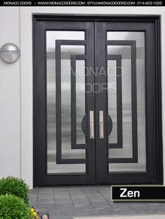 the front door is black and has two glass doors