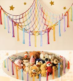 there are many different stuffed animals in the bowl and on the table with it's string decorations