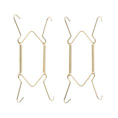 two pairs of gold earrings hanging from hooks on a white background with clippings in the shape of rectangles