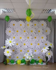 an office decorated with white daisies and balloons