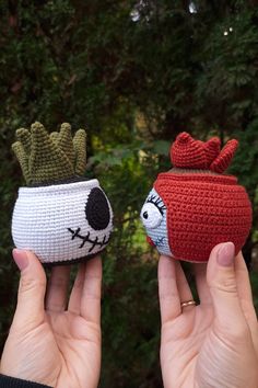 two handmade crocheted pots with plants in them, one is red and the other is white