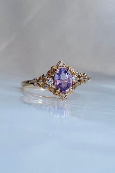 Arwen Fairy Purple Sapphire Engagement Ring Gold, Diamond Whimsical Engagement Ring, Fantasy Lavender Sapphire Ring by Eidelprecious - Etsy Purple Fantasy Ring, Purple And Gold Wedding Rings, Vintage Purple Engagement Rings, Engagement Rings Purple Sapphire, Engagement Rings Lilac, Studio Ghibli Engagement Ring, Gold Ring With Purple Stone, Blue And Purple Ring, Purple Amethyst Ring Engagement