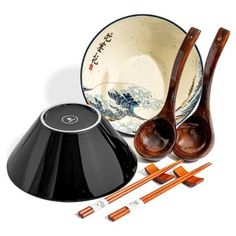 an assortment of wooden spoons and bowls with chopsticks