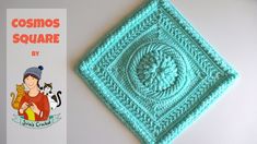 a crocheted square with a woman holding a cat on it and the book cosmos square