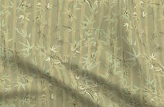 a green and beige background with small leaves on the outside, as well as stripes in the top right corner