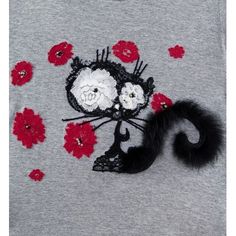 a grey shirt with red flowers and a black cat on the front that is sequins