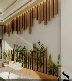 the interior of a modern house with wood slats on the wall and white chairs