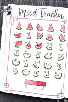 an open notebook with watermelon slices and numbers on the page, next to a pen