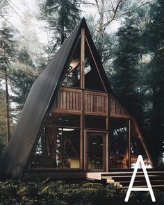 a - frame cabin in the woods with stairs leading up to it