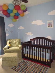 a baby's room is decorated with balloons