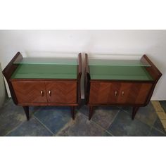 pair of mid century modern nightstands with green glass tops