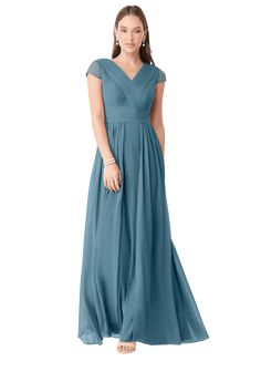 a woman in a long blue dress