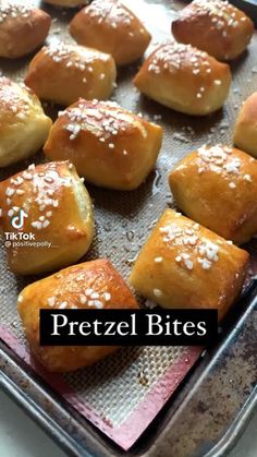 pretzel bites on a baking sheet with sesame seeds