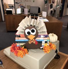 a turkey made out of books sitting on top of a desk