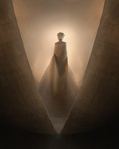 a woman standing in the middle of a tunnel