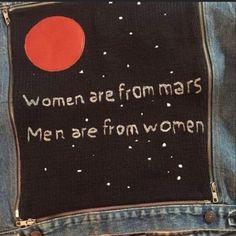 a pair of jeans with the words women are from mars written on them